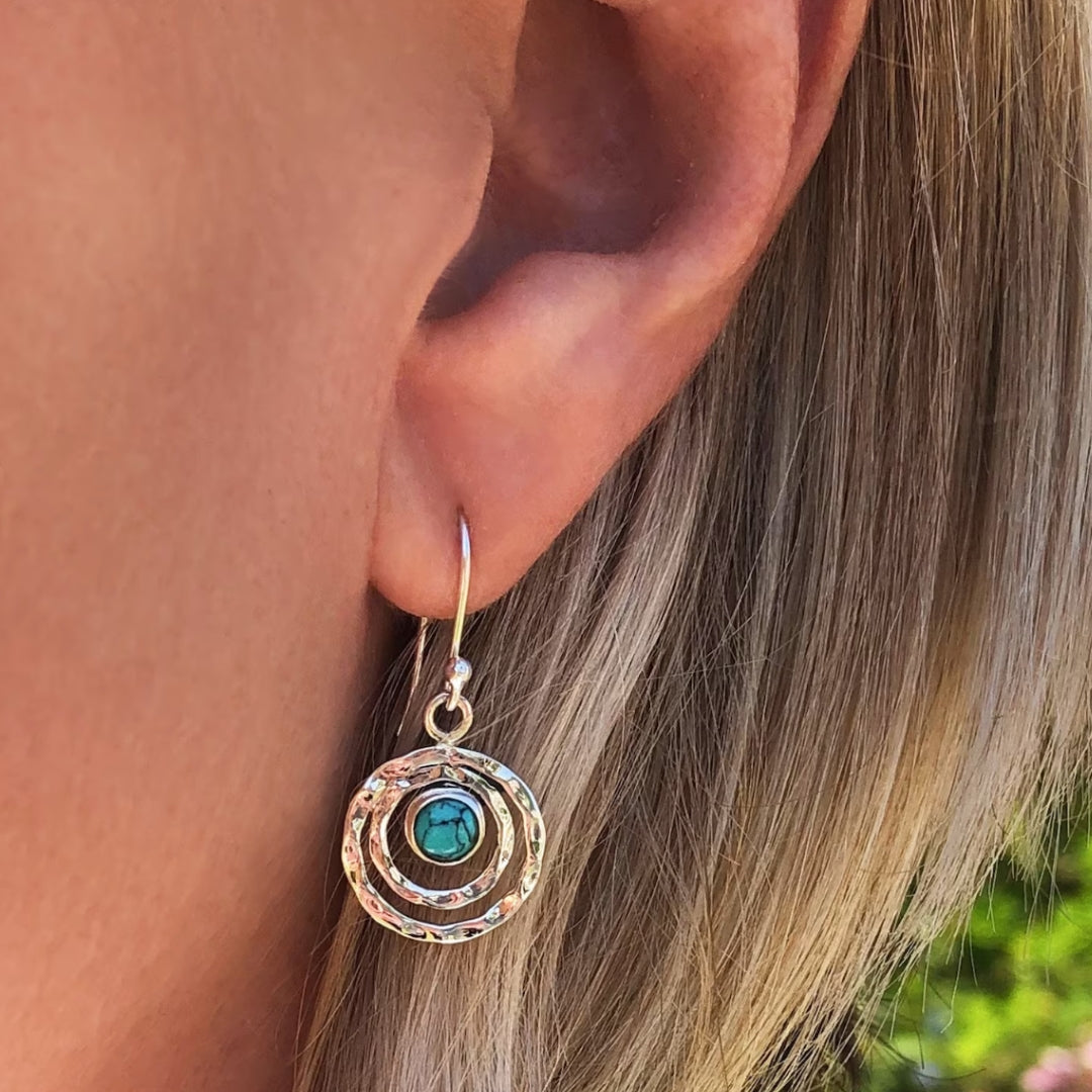 "Emma - Boucles d'oreilles Boho Saturne" could be rephrased as "Boucles d'oreilles Boho Saturne 'Emma'".