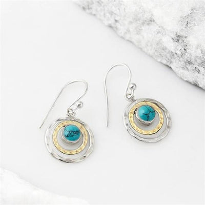 "Emma - Boucles d'oreilles Boho Saturne" could be rephrased as "Boucles d'oreilles Boho Saturne 'Emma'".