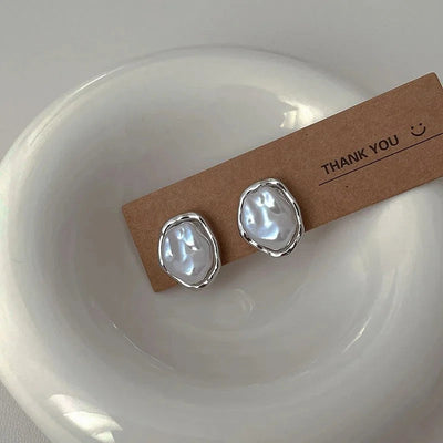 Élégantes boucles d'oreilles en perles par Carmen